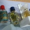 Perfumes en miniatura. Colección de 7 tarros en vidrio diferentes.