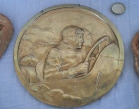 Placa automovilística de gran premio. En bronce