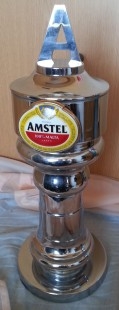 Grifo de cerveza en bronce blanco. Marca Amstel.