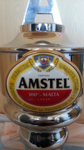 Grifo de cerveza en bronce blanco. Marca Amstel.